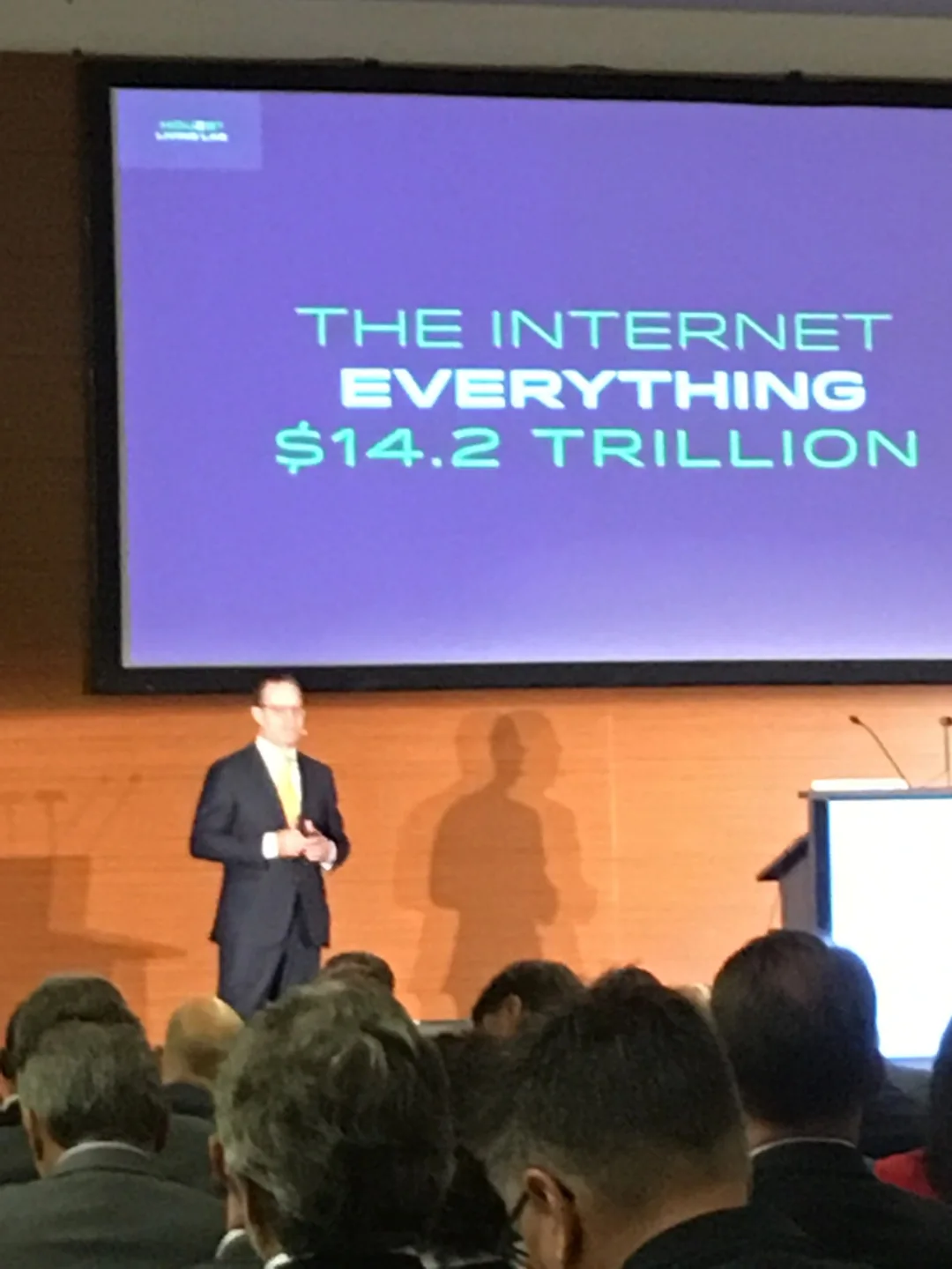 Speaker presenting about the internet's $14.2 trillion value.