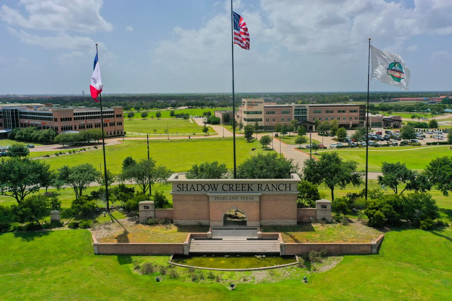 Shadow Creek Ranch entrance monument and surrounding development in Pearland