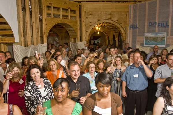 Attendees gathered inside a home under construction at the Sneak Preview Custom Home Event in Clear Lake, Texas.